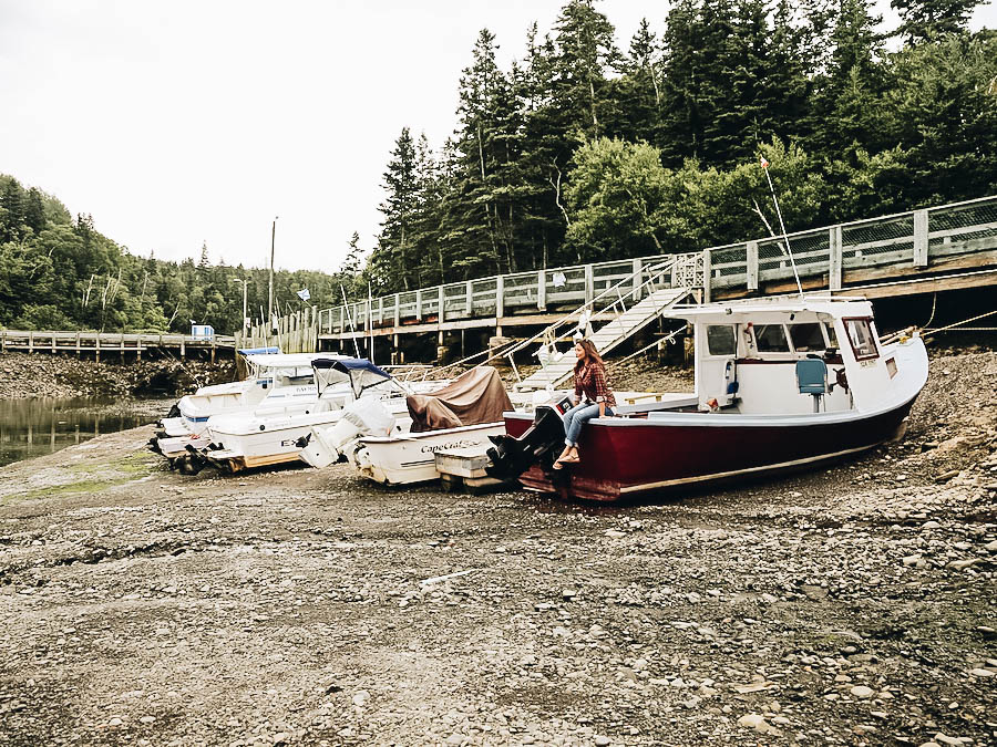 Annette seating on a boat at Bay of Fundy Tides