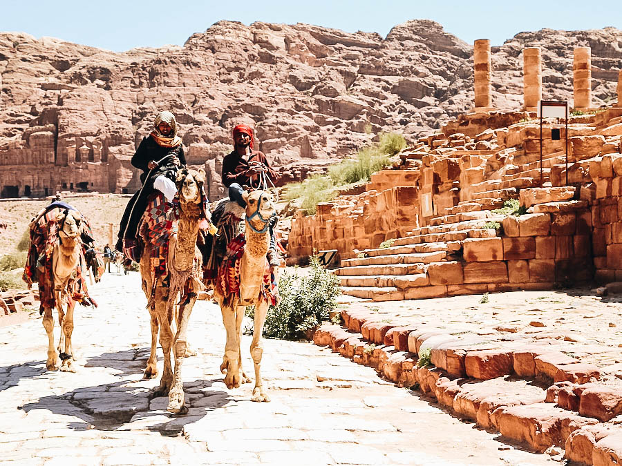 Getting around Petra riding a camel;