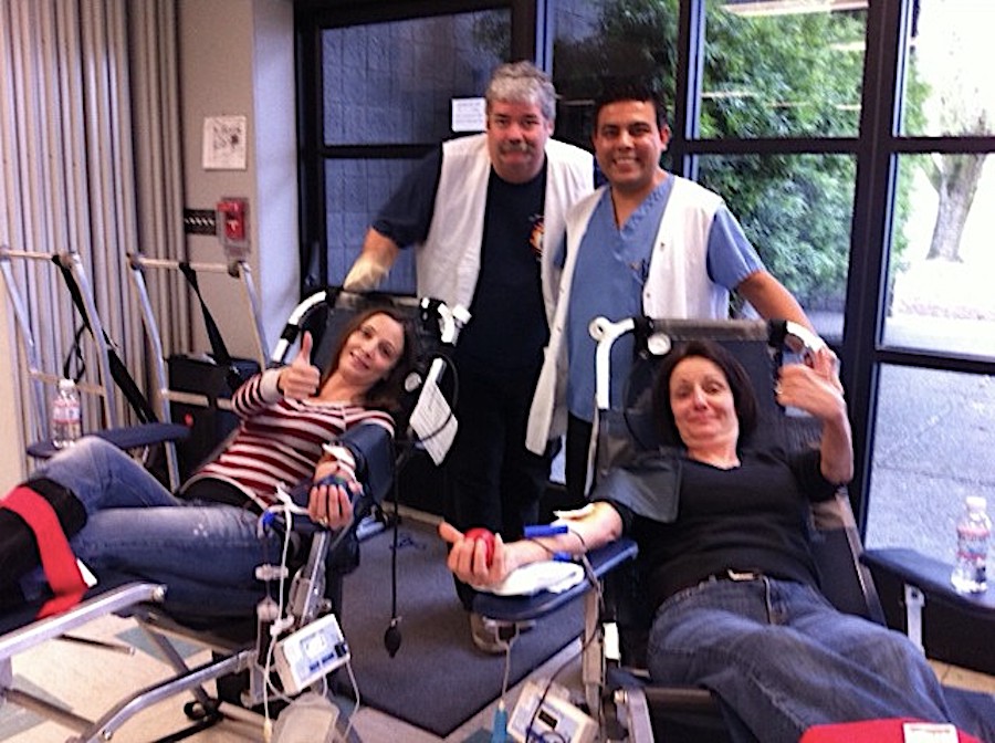 thumbs up for two ladies giving blood